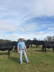 Robert King, 5th Generation Cattle Farmer, stands in front of his Black Angus Cows