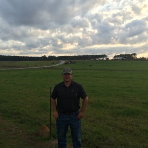 Michael Dansby in front of his Family's Cattle Farm in Lowndes County